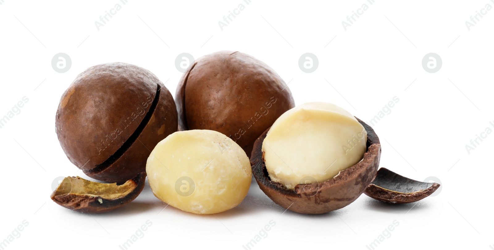 Photo of Pile of organic Macadamia nuts on white background