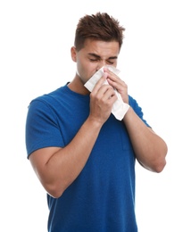 Young man suffering from allergy on white background