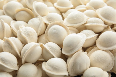 Raw dumplings as background, closeup. Home cooking