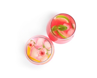 Photo of Glasses of tasty refreshing drinks on white background, top view