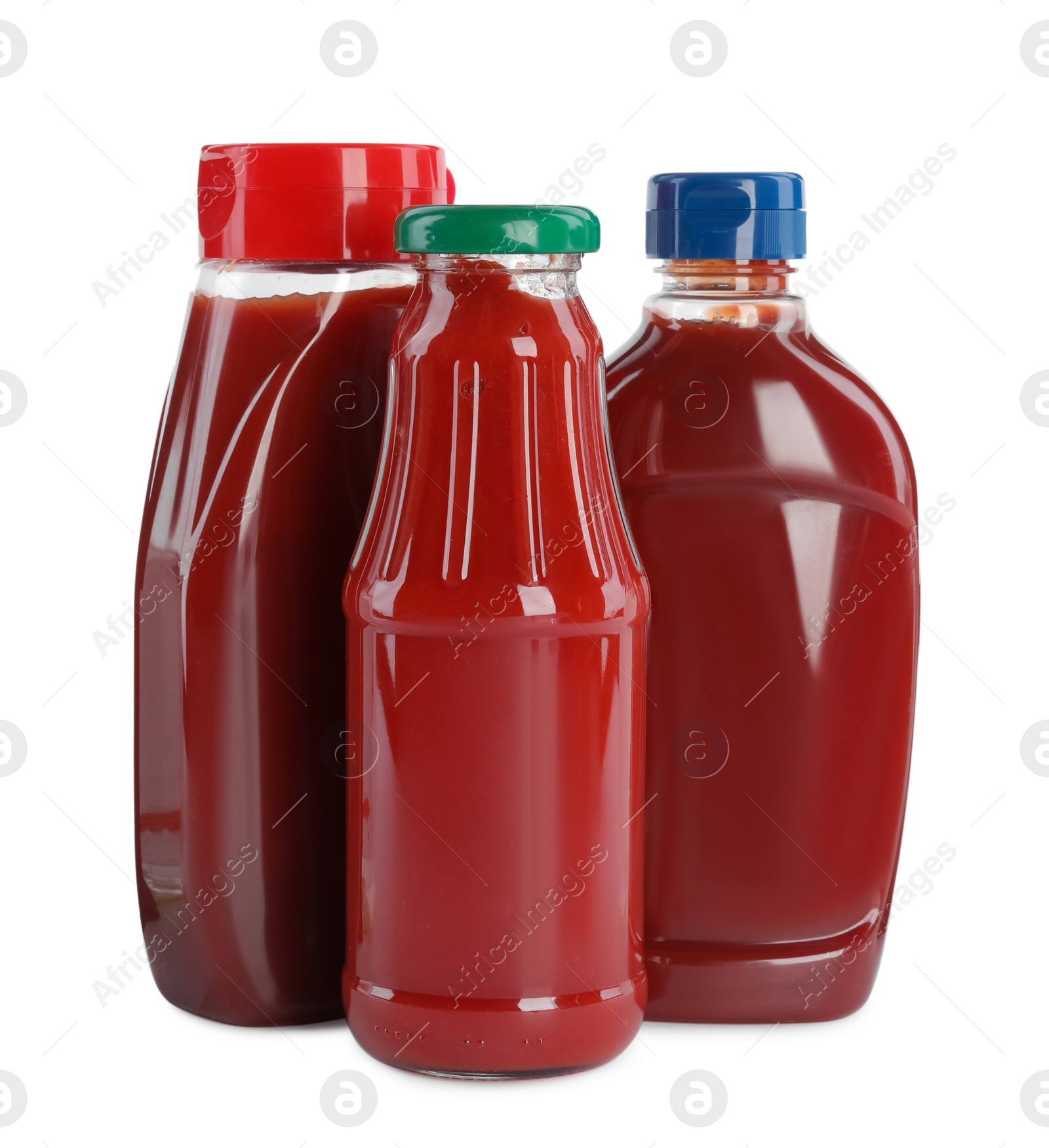 Photo of Different bottles of ketchup on white background