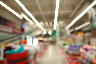 Photo of Blurred view of modern shopping mall interior