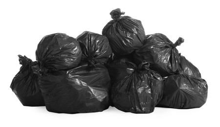 Black trash bags full of garbage on white background