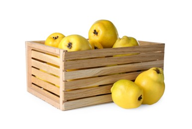 Photo of Wooden crate with delicious fresh ripe quinces isolated on white