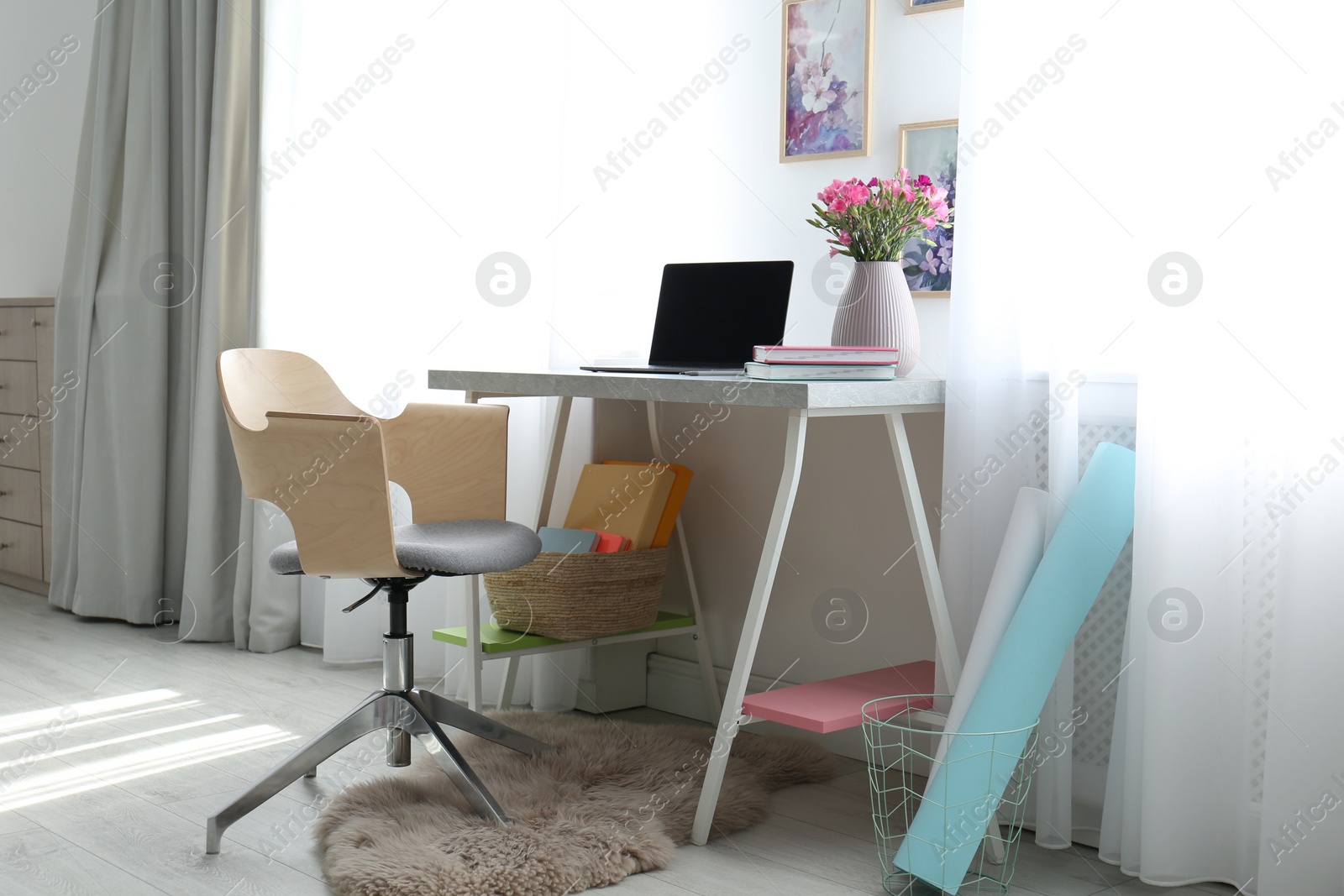 Photo of Comfortable workplace with office chair and modern table