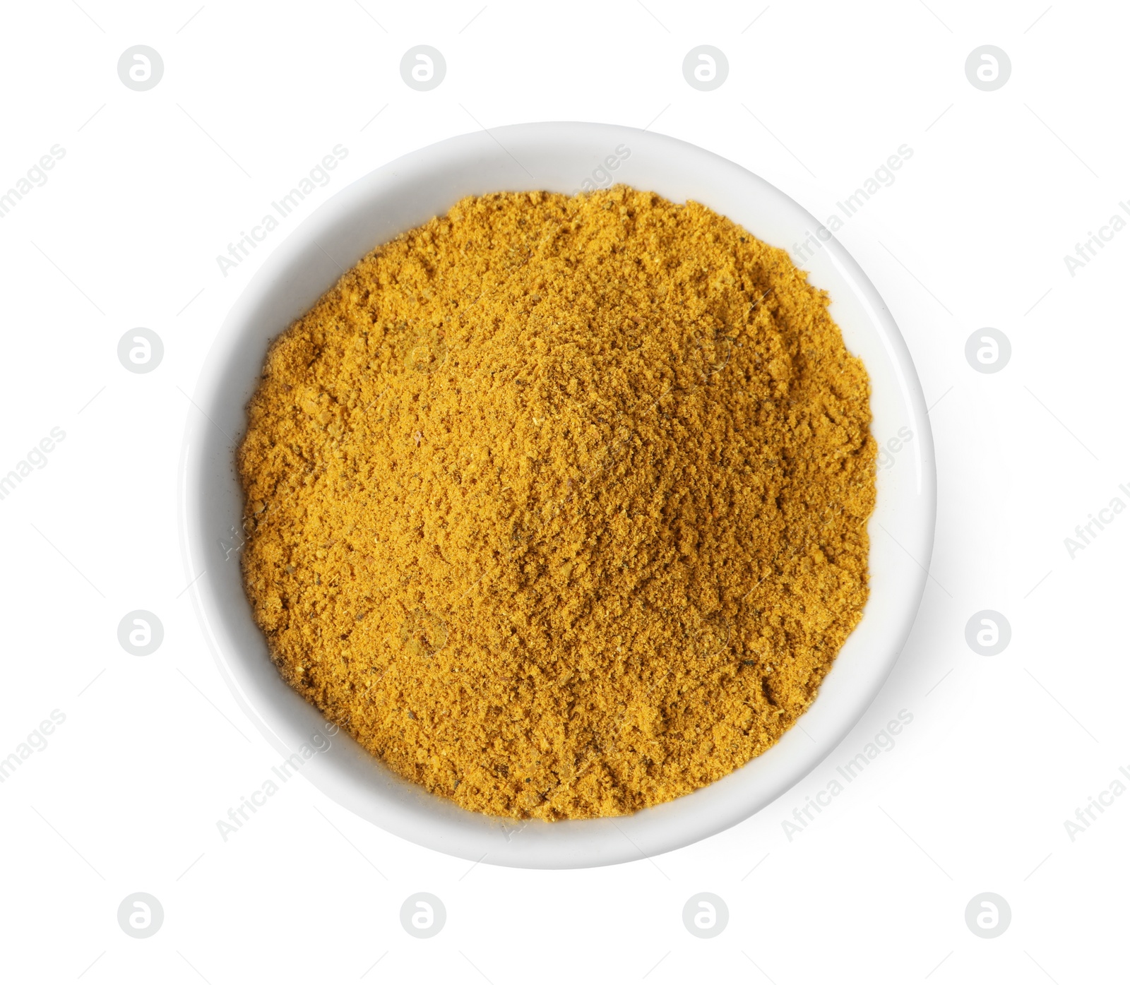 Photo of Dry curry powder in bowl isolated on white, top view