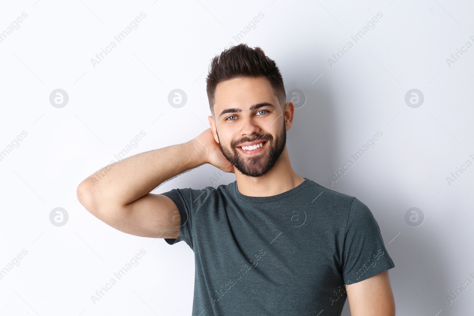 Photo of Portrait of handsome smiling man isolated on white