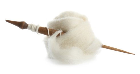 Photo of Ball of combed wool with wooden spindle isolated on white