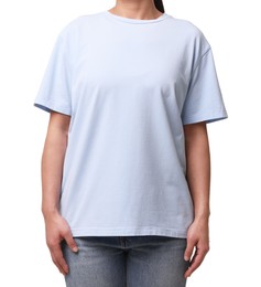 Woman wearing light blue t-shirt on white background, closeup