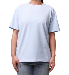 Photo of Woman wearing light blue t-shirt on white background, closeup