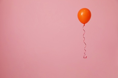 Photo of Bright balloon on color background, space for text. Celebration time