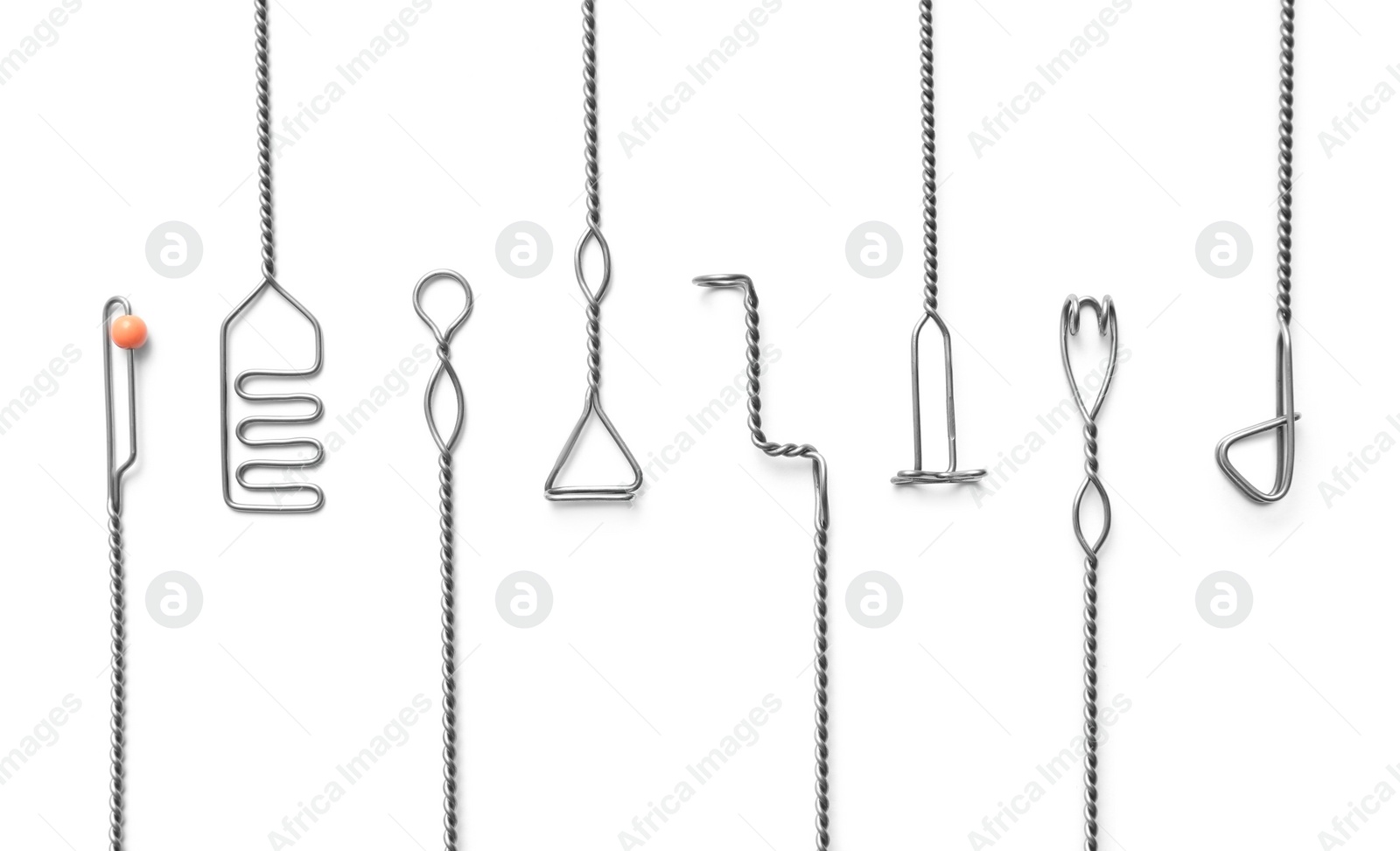 Photo of Set of logopedic probes on white background, top view. Speech therapist's tools