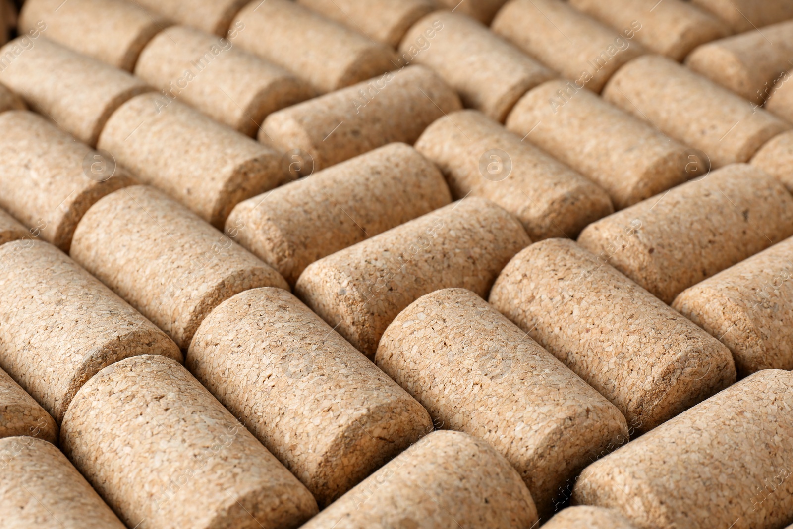 Photo of Many corks of wine bottles as background, closeup