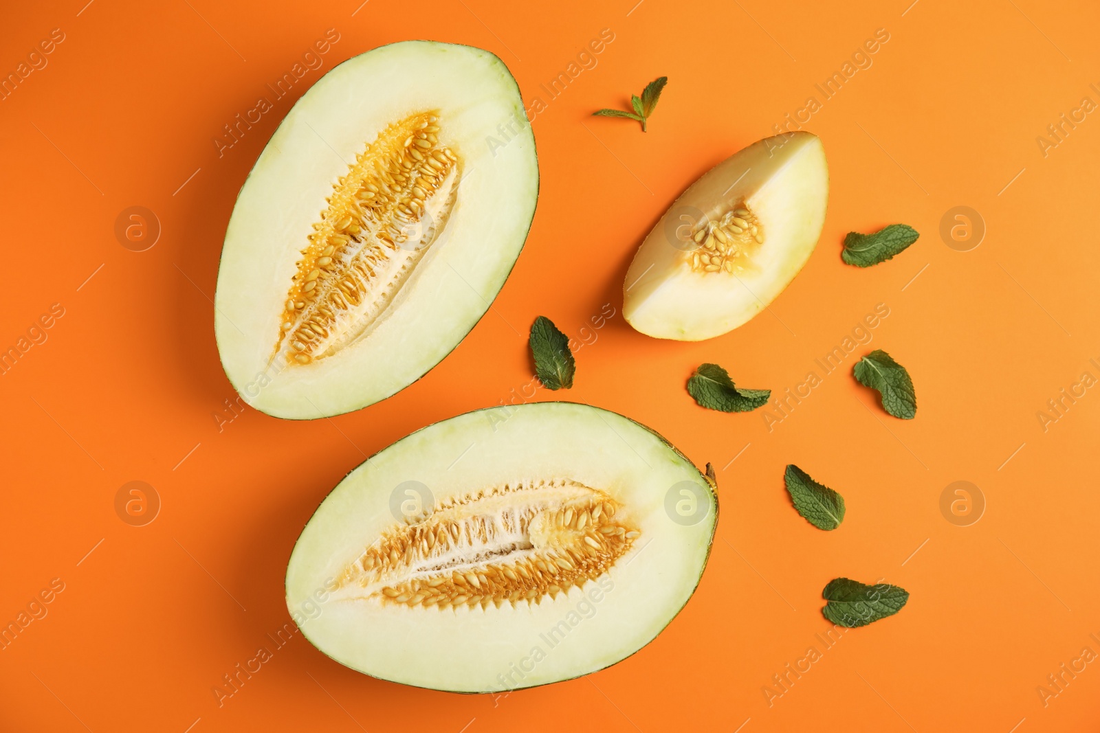 Photo of Flat lay composition with melon and mint leaves on color background