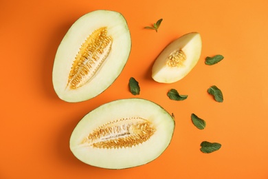 Photo of Flat lay composition with melon and mint leaves on color background