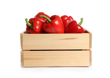 Photo of Wooden crate with tasty bell peppers on white background