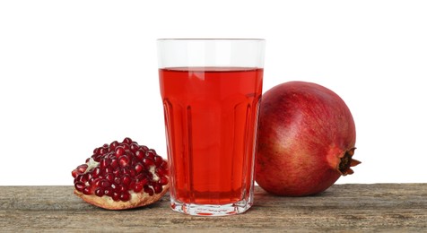 Photo of Refreshing pomegranate juice in glass and fruits on wooden table against white background