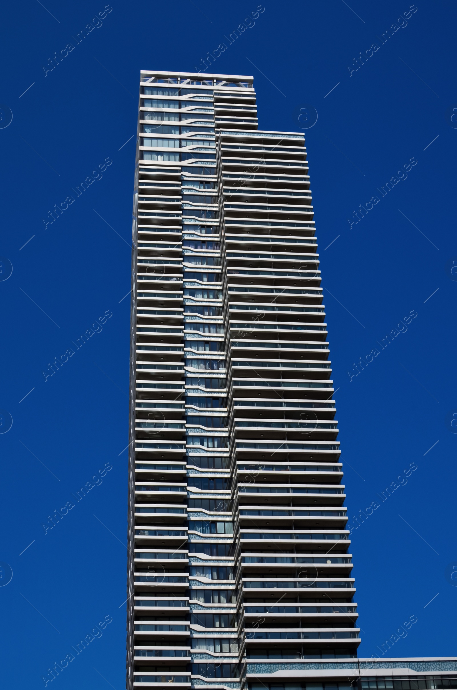 Photo of Exterior of beautiful modern building against blue sky