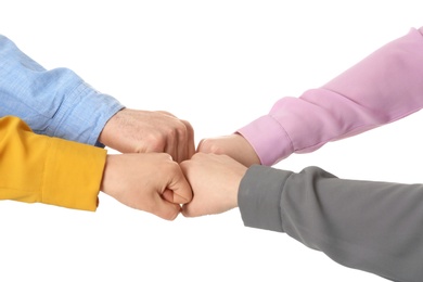 Photo of Young people putting their hands together on white background, closeup