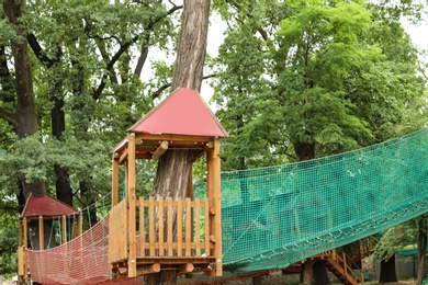 Photo of Adventure park with ropes course for children outdoors
