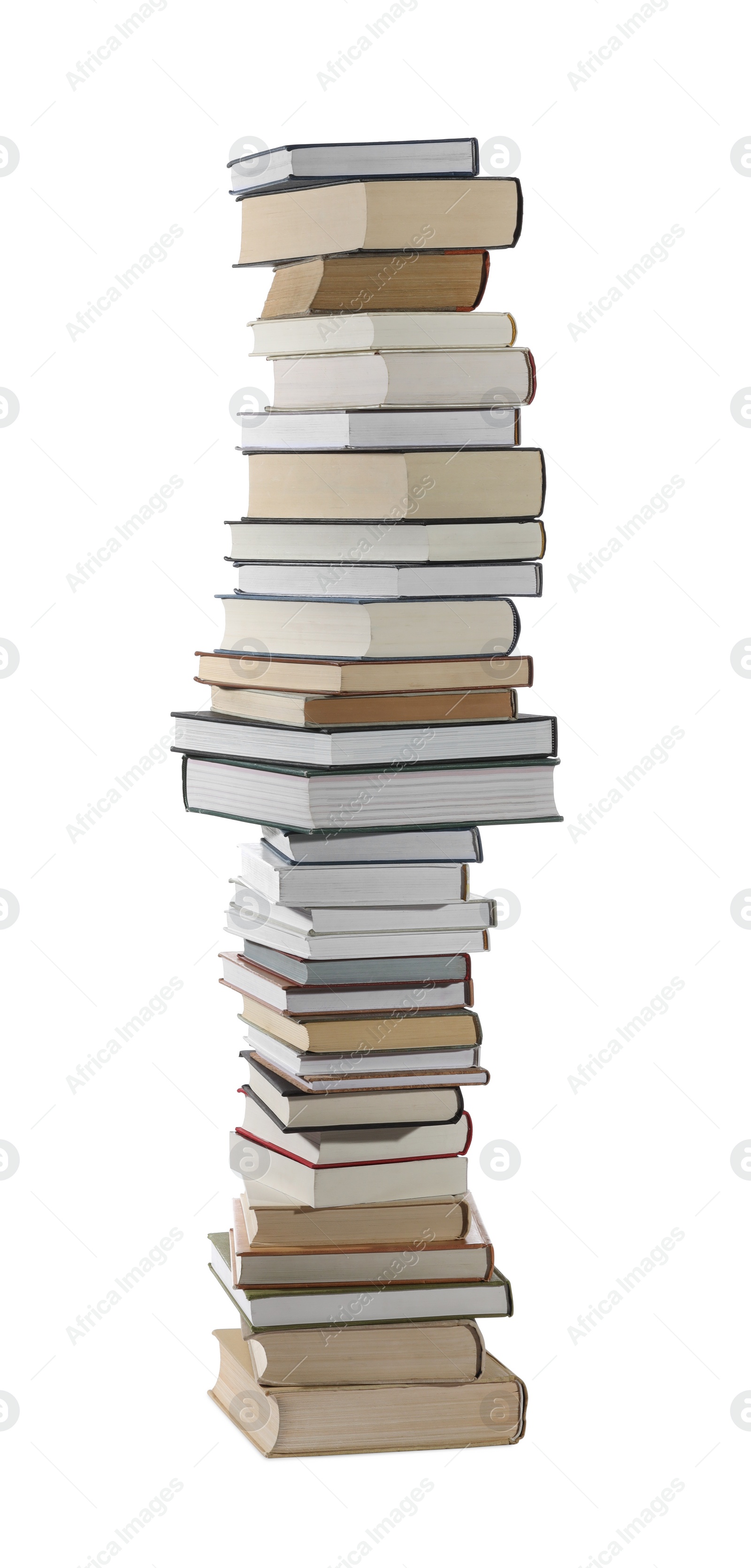 Photo of High stack of many different books isolated on white