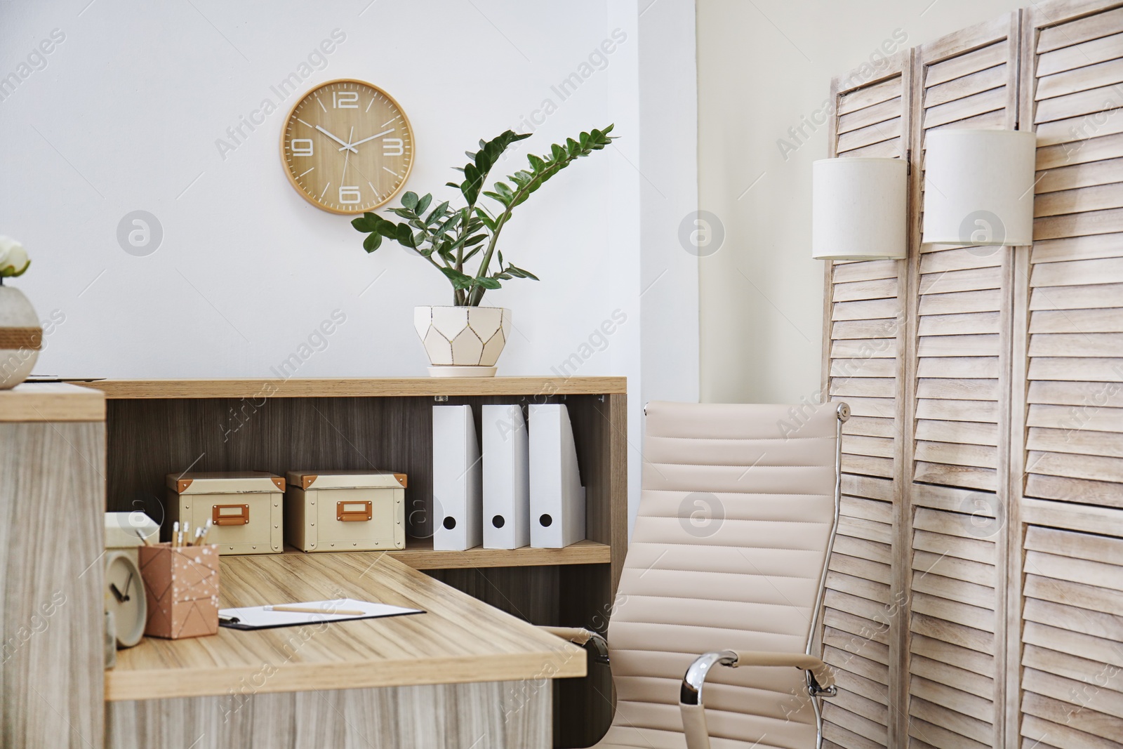 Photo of Receptionist desk in hotel. Workplace interior