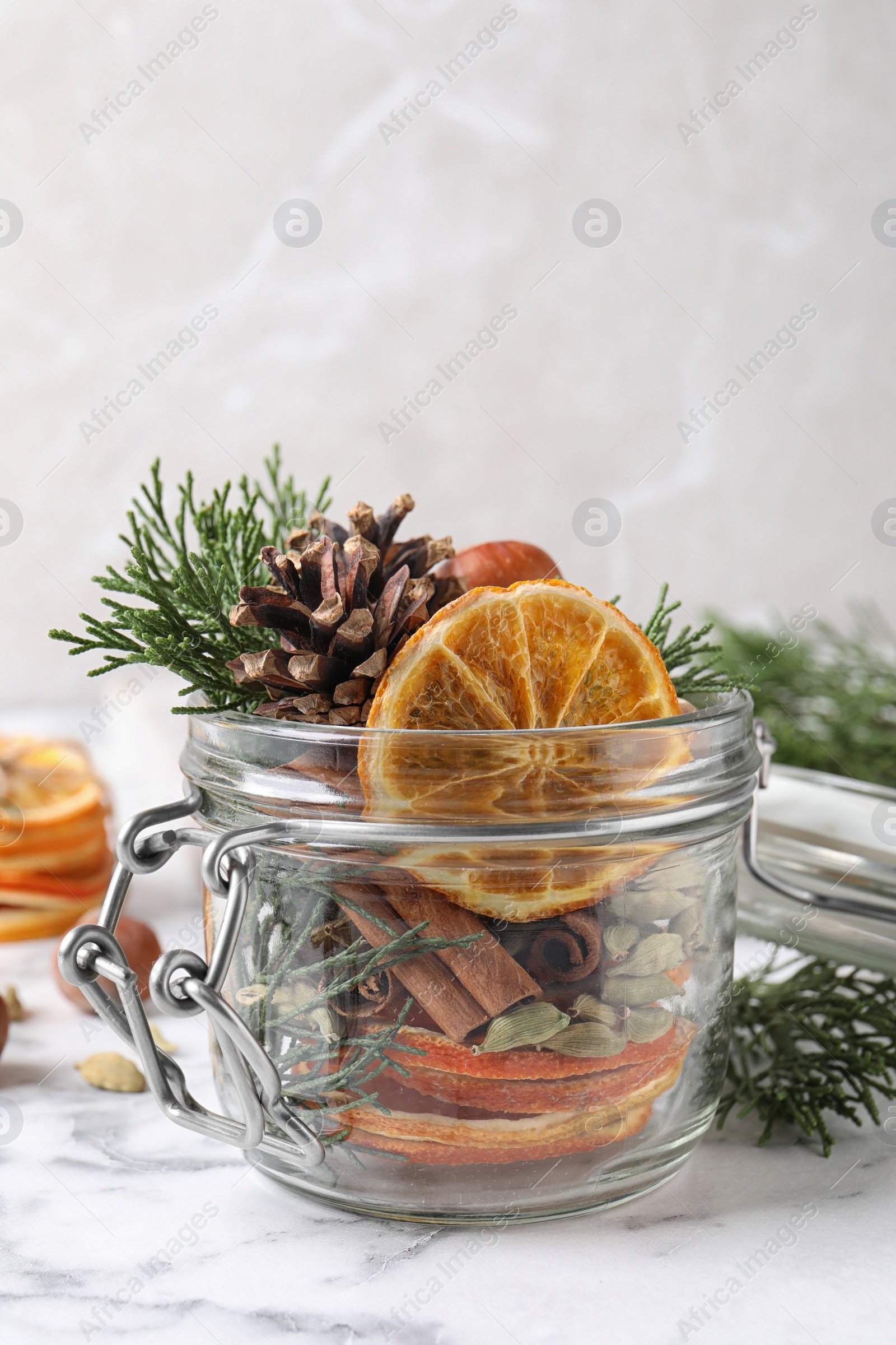 Photo of Aroma potpourri with different spices on white marble 
table