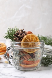 Aroma potpourri with different spices on white marble 
table