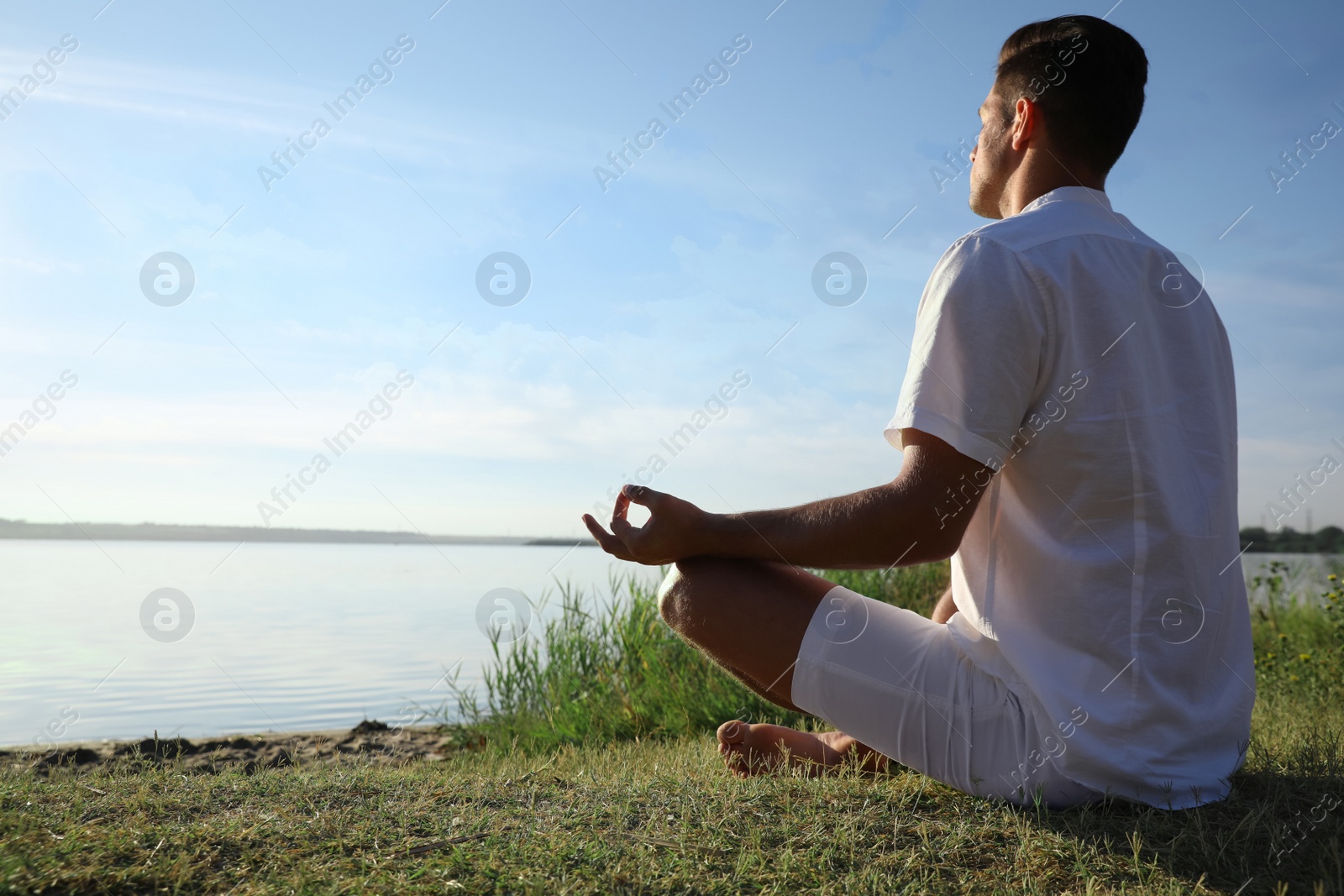 Photo of Man near river at sunset, space for text. Nature healing power