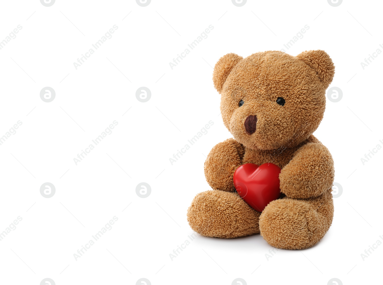 Photo of Cute teddy bear with red heart isolated on white. Valentine's day celebration