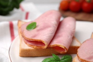 Photo of Delicious sandwich with ham on plate, closeup