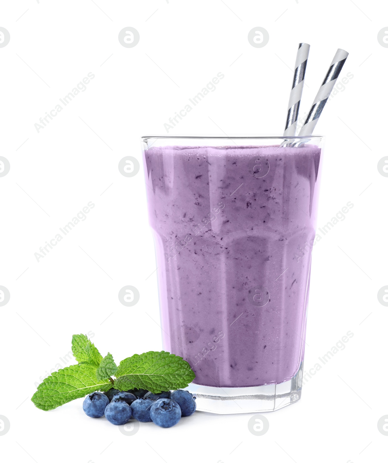 Photo of Tasty fresh milk shake in glass and blueberries on white background