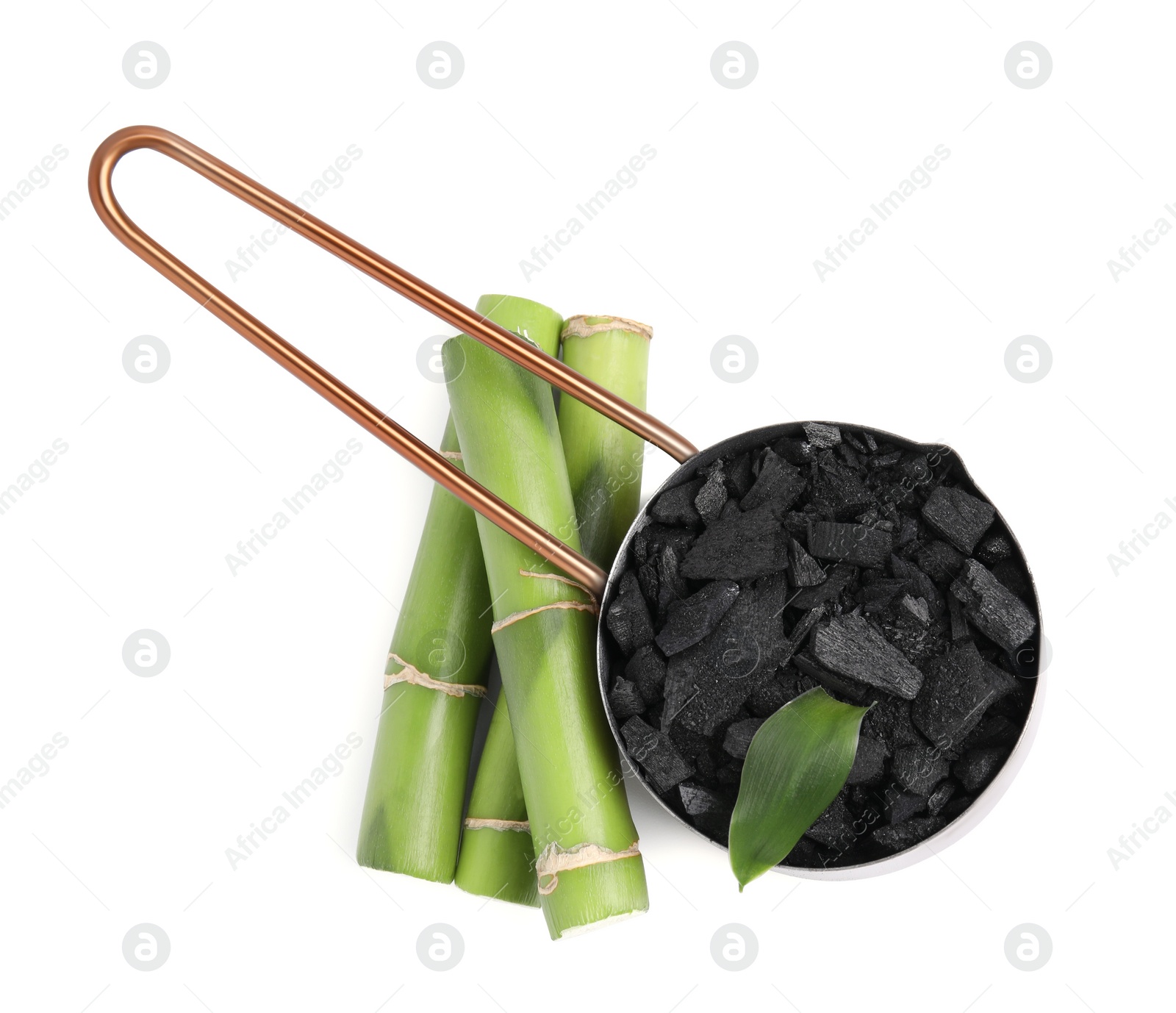 Photo of Fresh bamboo and charcoal on white background, top view