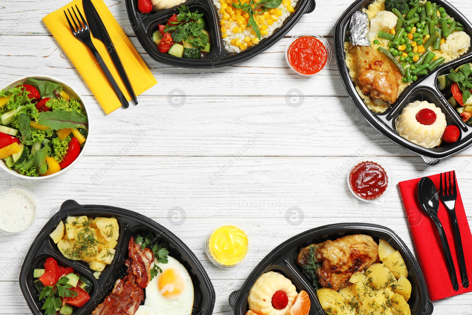 Photo of Frame made of lunchboxes on white table, top view with space for text. Healthy food delivery