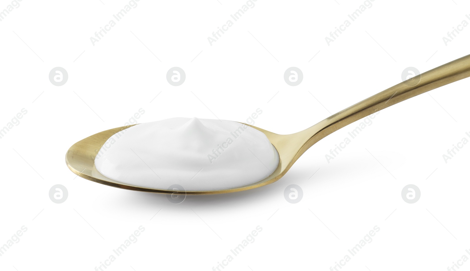 Photo of Golden spoon with sour cream isolated on white