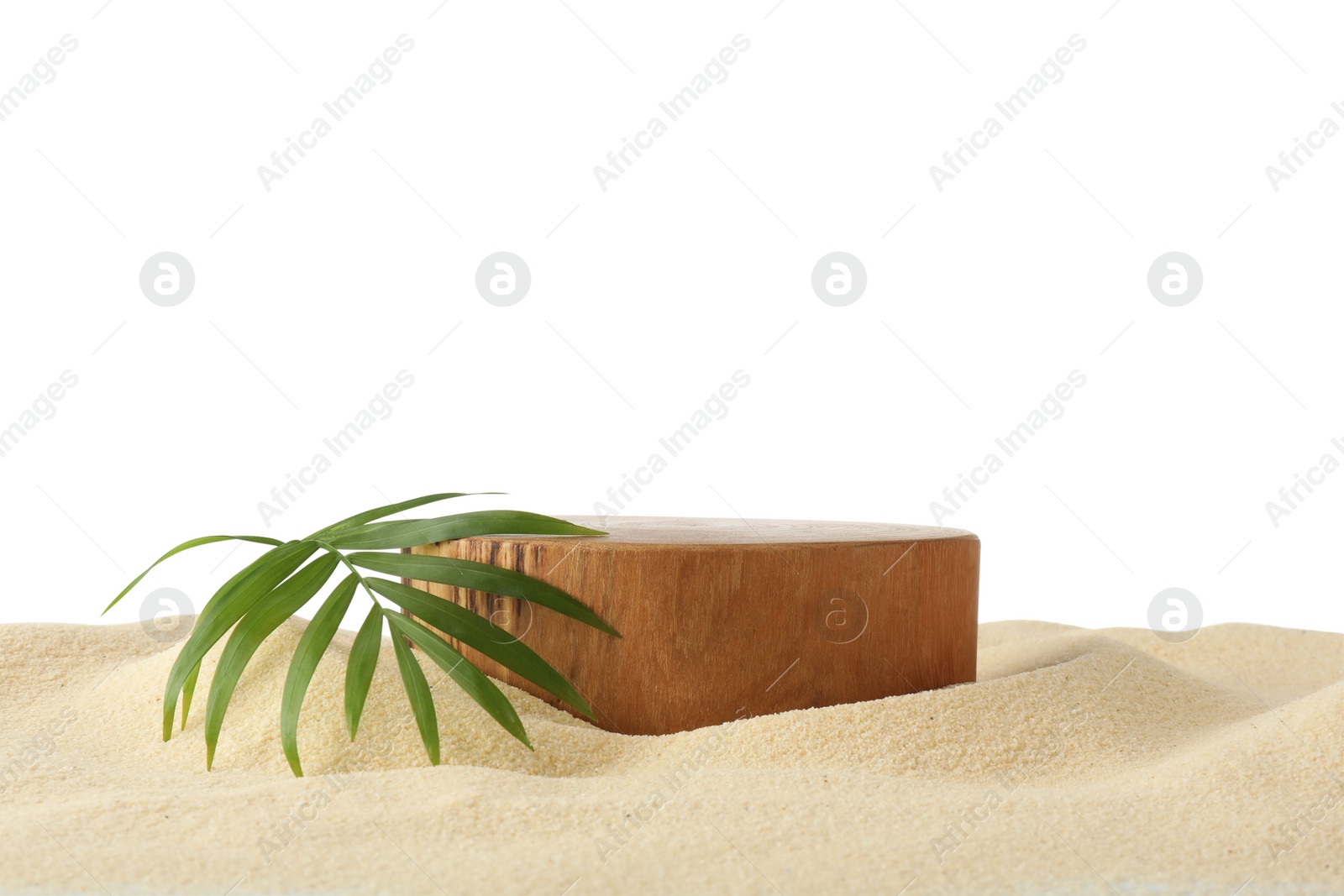 Photo of Presentation of product. Wooden podium and palm Leaf on sand against white background