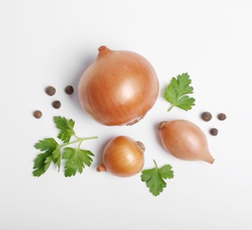 Beautiful composition with ripe onions on white background