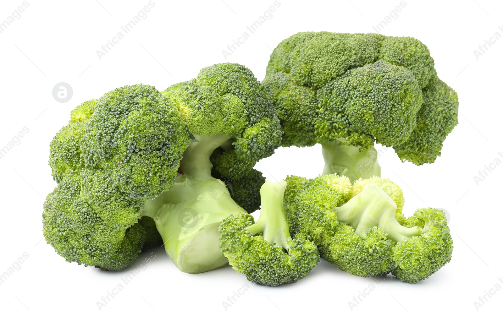 Photo of Pile of fresh raw green broccoli isolated on white