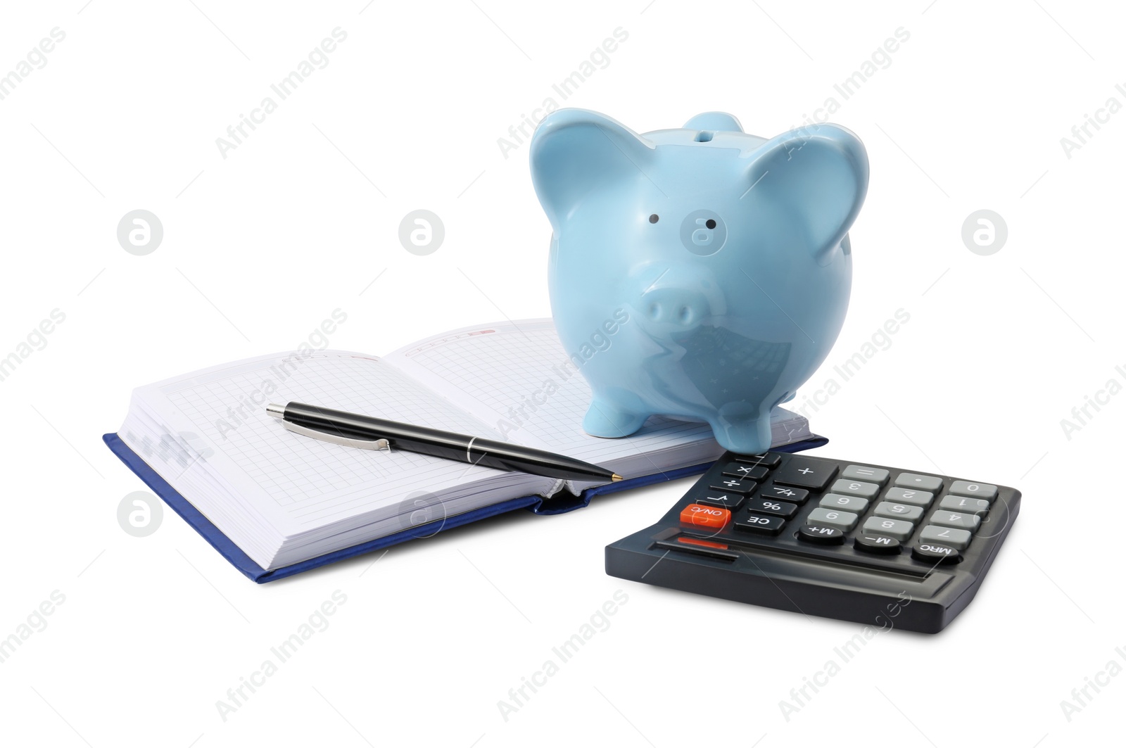 Photo of Calculator, piggy bank, pen and notebook isolated on white