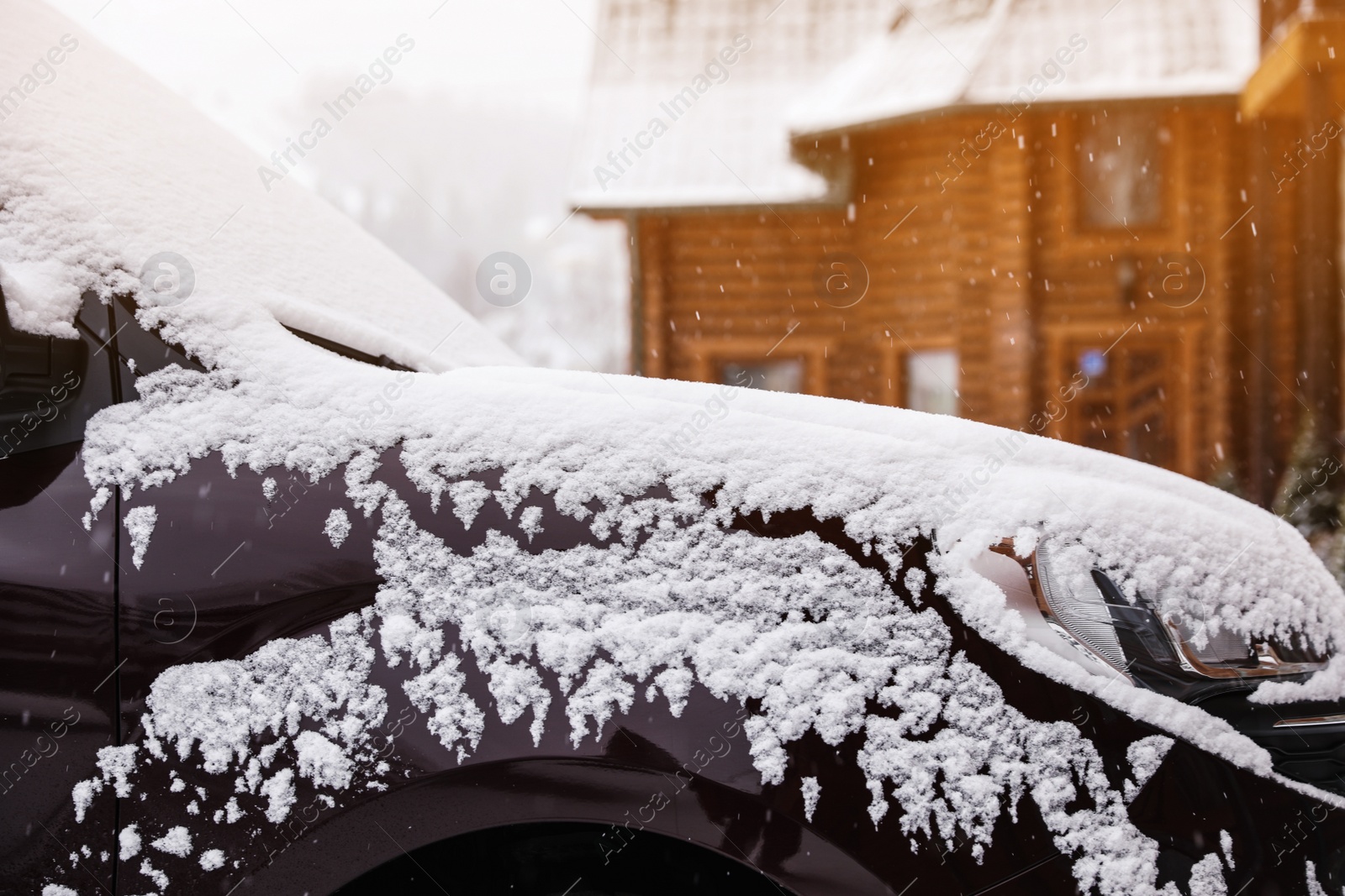 Photo of Car covered with snow after storm outdoors on beautiful winter day, closeup