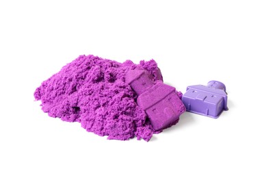 Photo of Castle made of purple kinetic sand and plastic mold isolated on white
