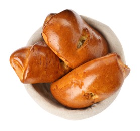 Photo of Basket with delicious baked patties on white background, top view