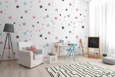 Image of Modern room interior for child with comfortable furniture and cute wallpapers