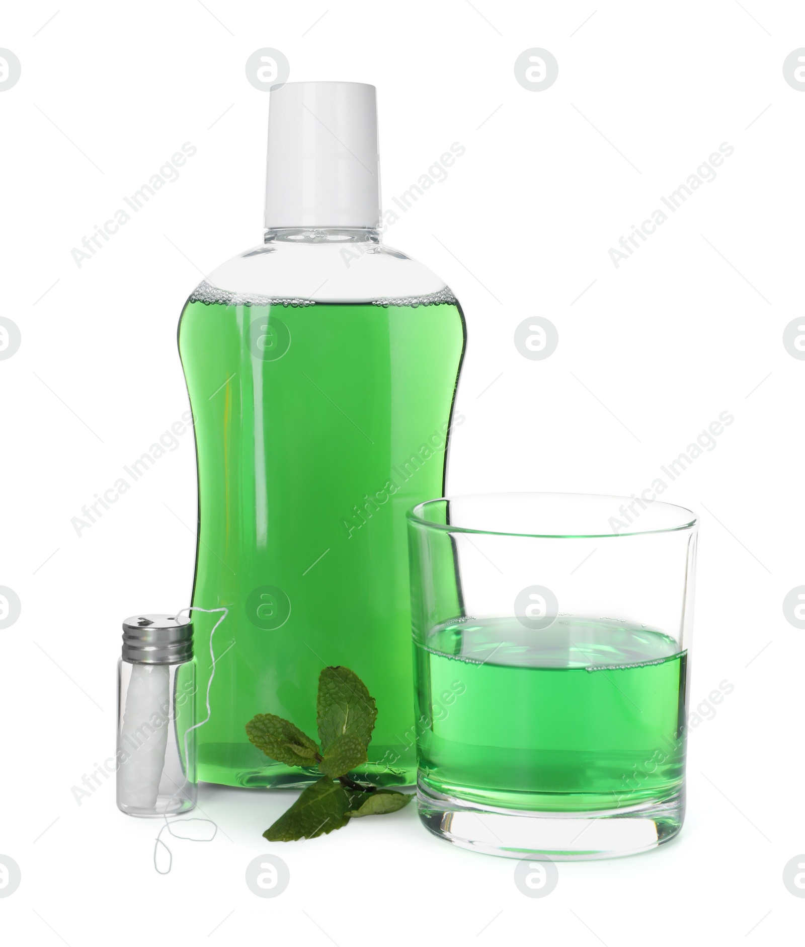 Photo of Mouthwash, dental floss and mint isolated on white