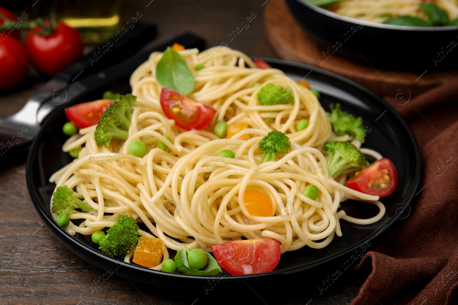 Photo of Plate of delicious pasta primavera, closeup view