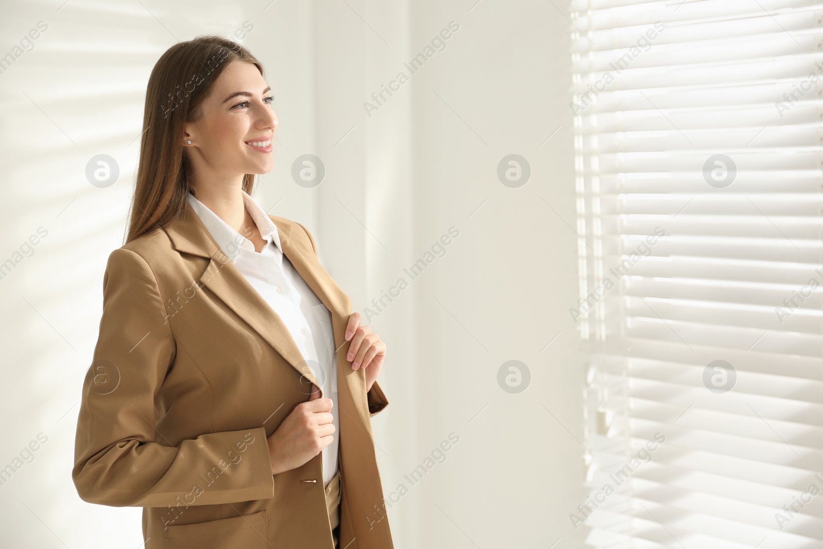 Photo of Portrait of beautiful young businesswoman in office