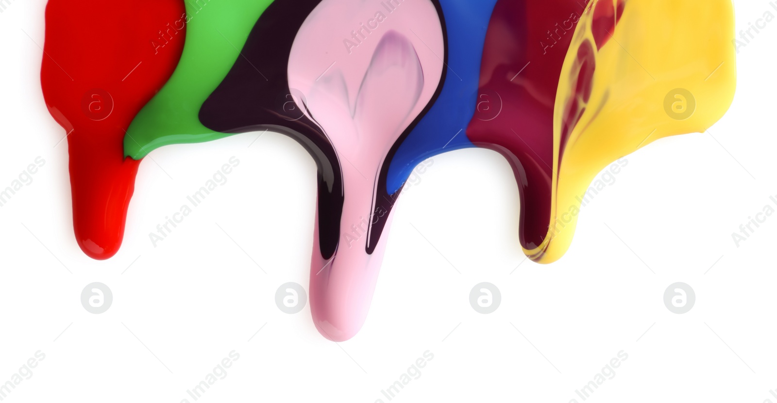 Photo of Mixed different color nail polishes flowing on white background
