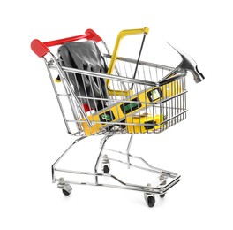 Photo of Small shopping cart with set of construction tools and gloves isolated on white