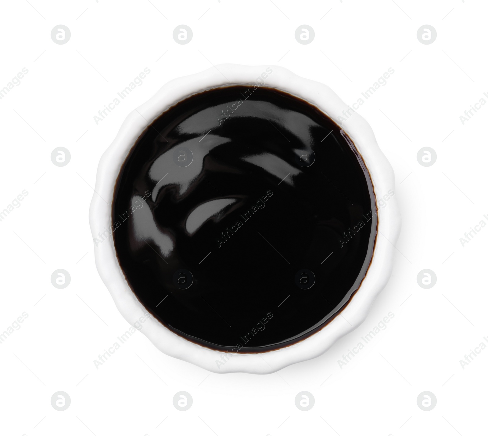 Photo of Bowl with balsamic glaze isolated on white, top view