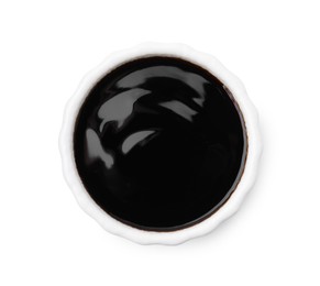 Photo of Bowl with balsamic glaze isolated on white, top view